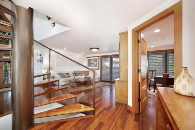 a view of a porch with chairs and backyard