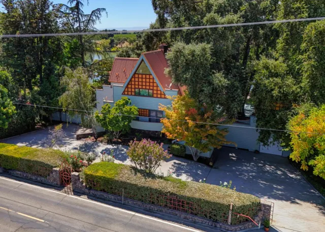 a wooden bench sitting in front of a building