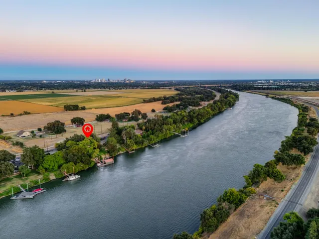 a backyard of a house with outdoor seating