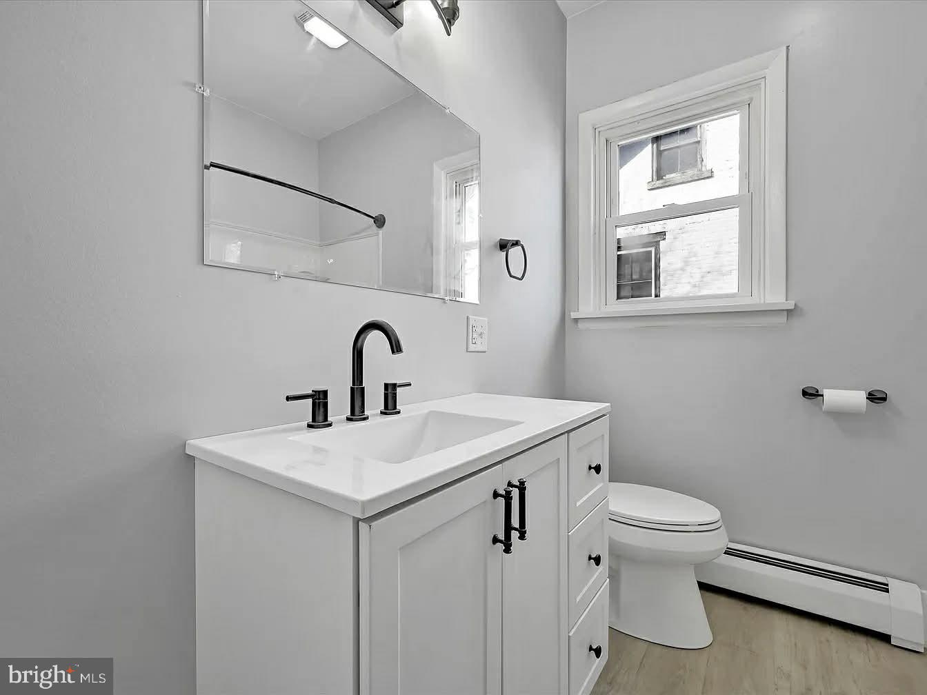 2602 East King Street Lebanon, PA 17042 - Photo 16 of 23 a bathroom with a toilet sink and mirror