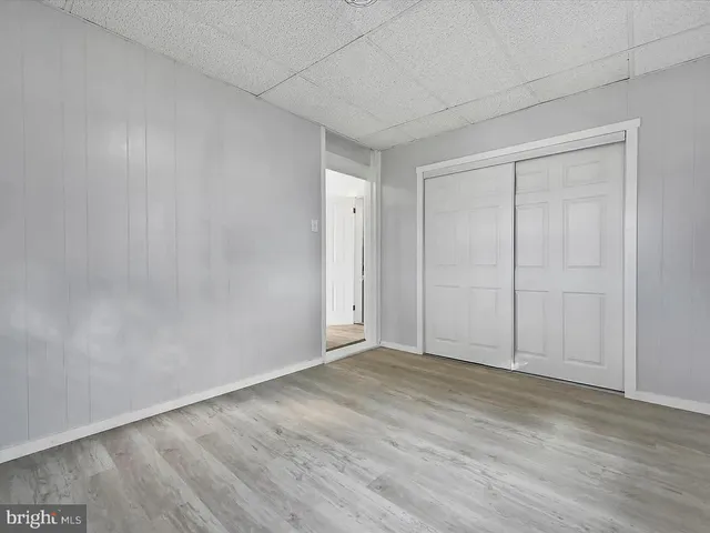 a view of an empty room and wooden floor
