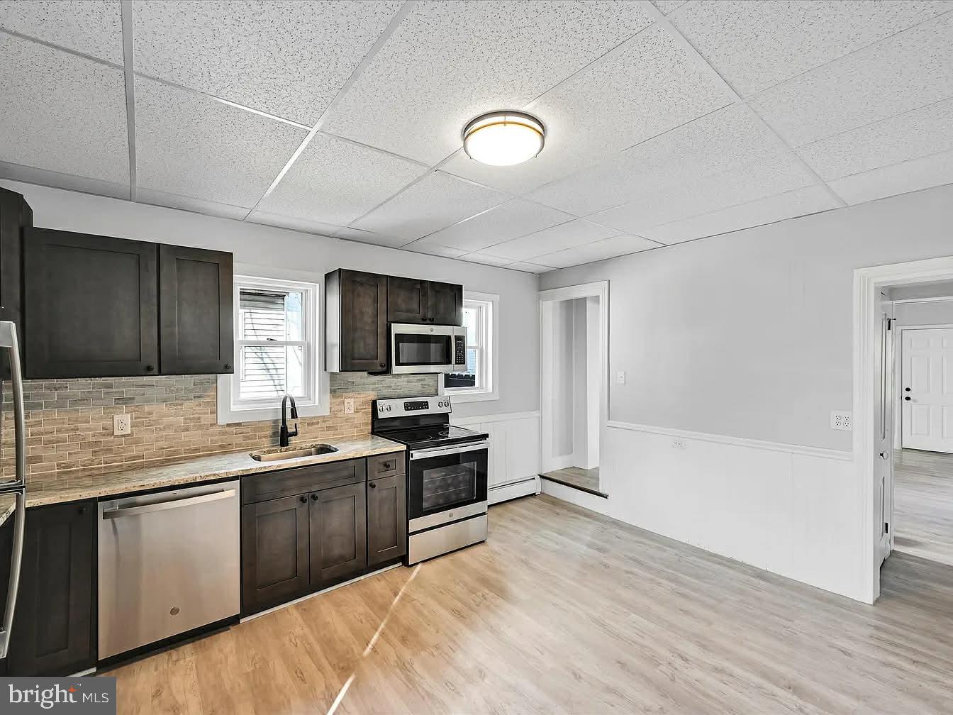2602 East King Street Lebanon, PA 17042 - Photo 3 of 23 a kitchen with a sink a stove and cabinets