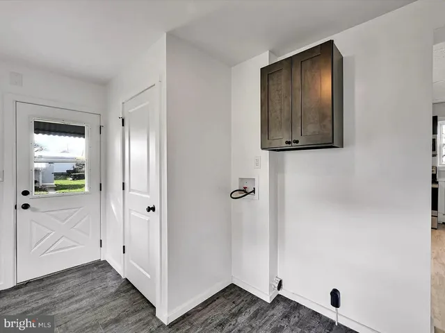 a view of an entryway with wooden floor