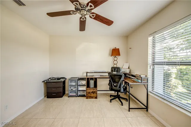 a view of a workspace with furniture