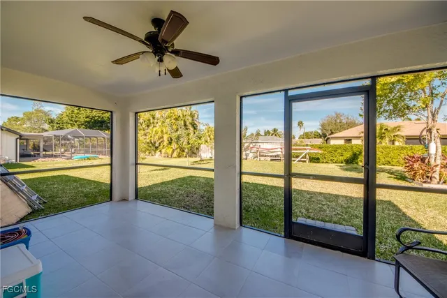 a view of a porch with furniture and garden
