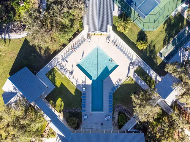 a view of a chairs and table in patio