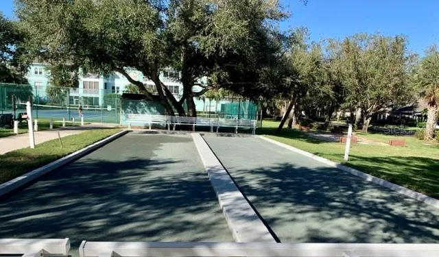 a view of a house with porch and chairs