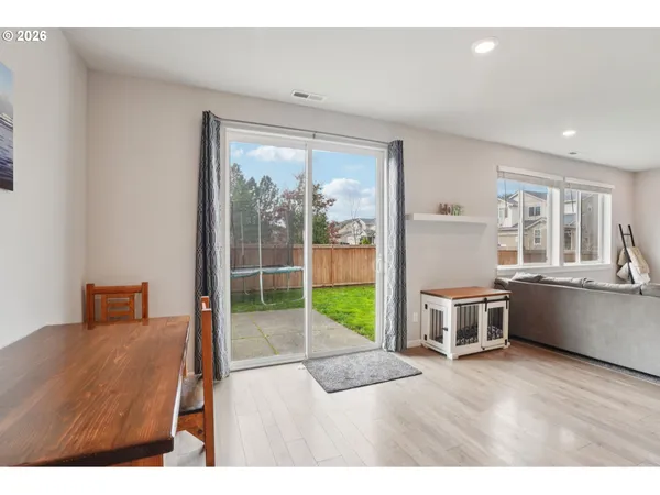 a living room with a furniture and a large window