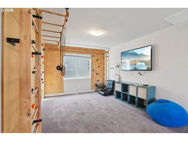 a view of hallway with chandelier and a wooden floor