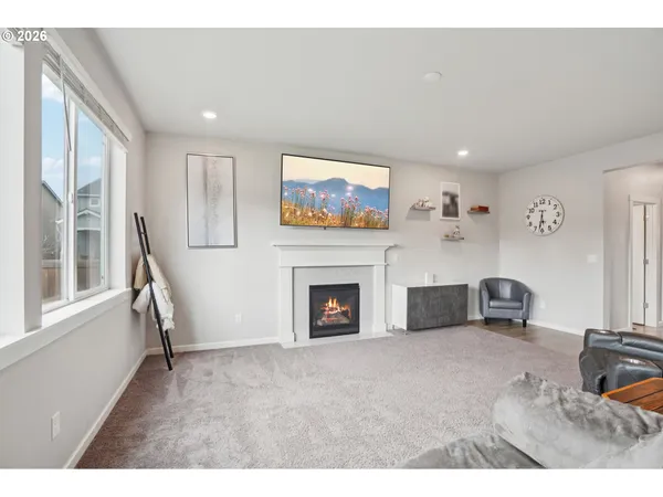 a view of a livingroom with furniture and a fireplace