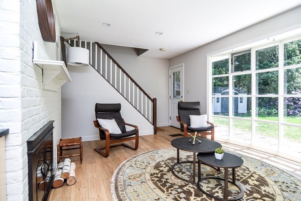 9 Braemore Road Natick, MA 01760 - Photo 15 of 24 a living room with furniture and a fireplace