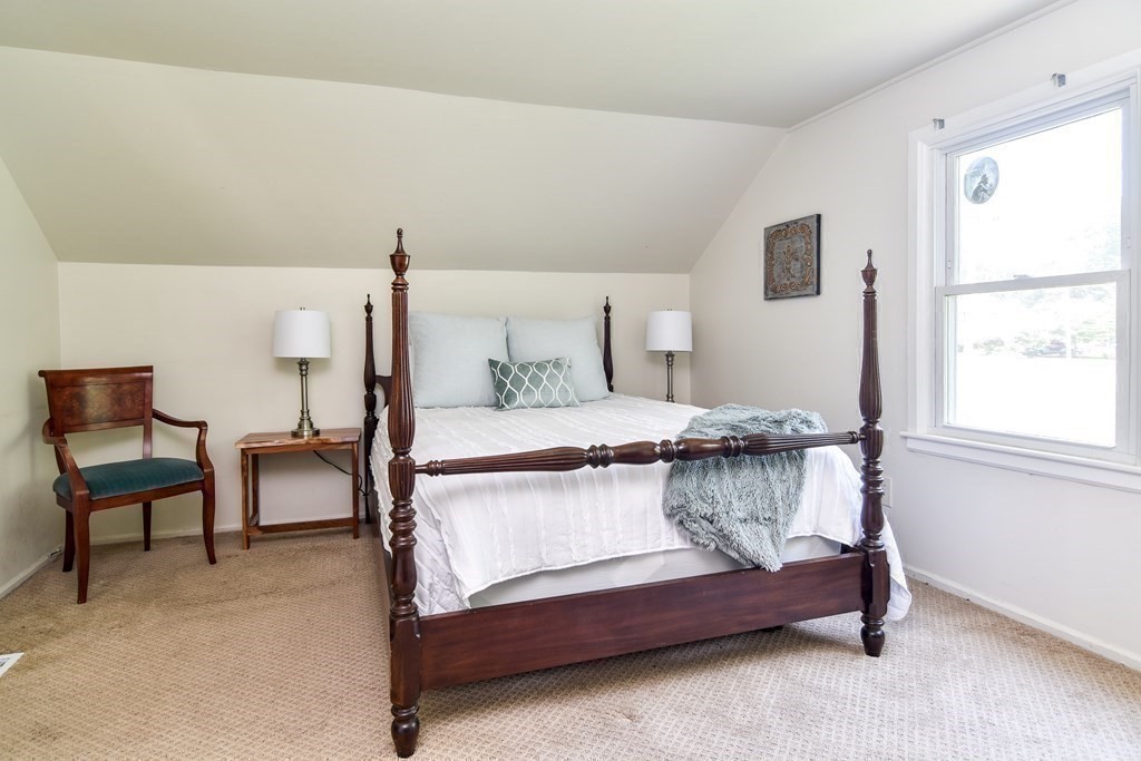 9 Braemore Road Natick, MA 01760 - Photo 16 of 24 a living room with furniture and a window