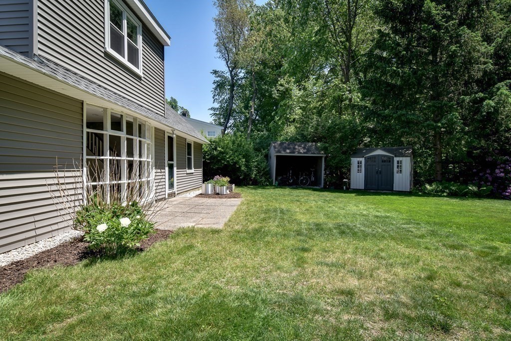 9 Braemore Road Natick, MA 01760 - Photo 21 of 24 a view of a house with backyard and garden