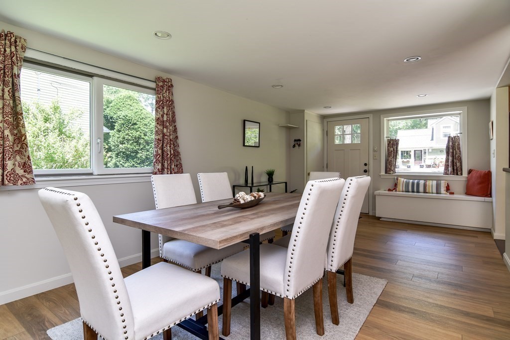 9 Braemore Road Natick, MA 01760 - Photo 4 of 24 a view of a dining room with furniture window and wooden floor