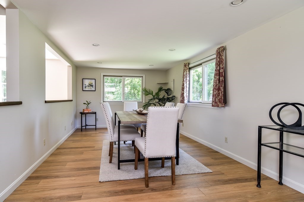 9 Braemore Road Natick, MA 01760 - Photo 5 of 24 a view of a a dining room with furniture window and wooden floor