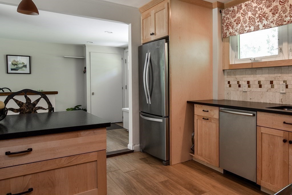9 Braemore Road Natick, MA 01760 - Photo 8 of 24 a kitchen with metallic refrigerator and window