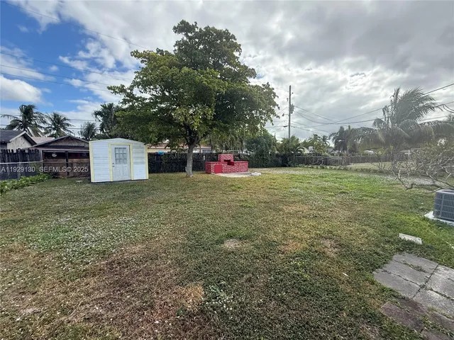 a view of a couches with wooden fence