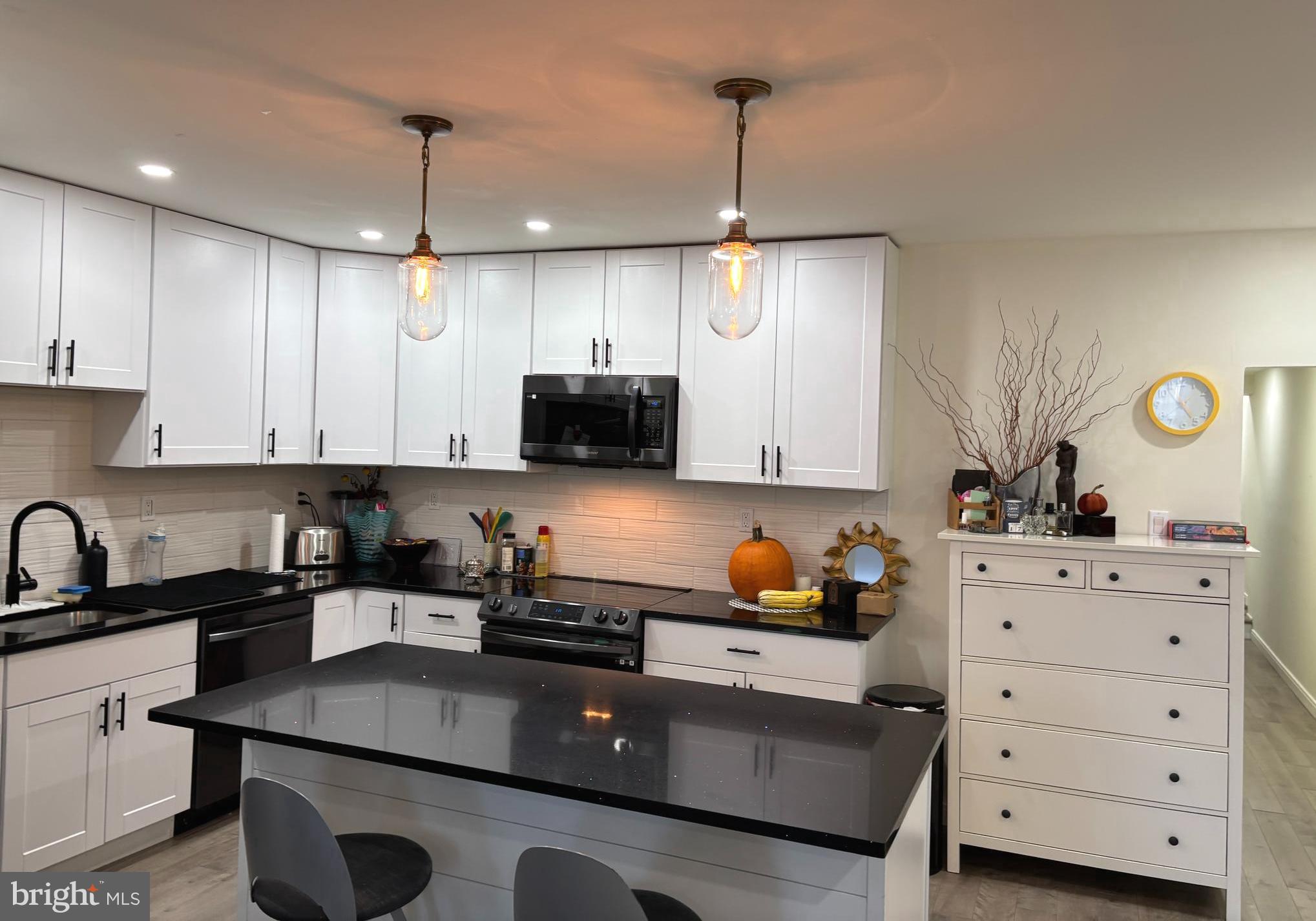 2694 Bridge Street Philadelphia, PA 19137 - Photo 29 of 41 a kitchen with stainless steel appliances granite countertop a sink a stove and a refrigerator