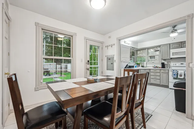 a view of a dining room with furniture and a table