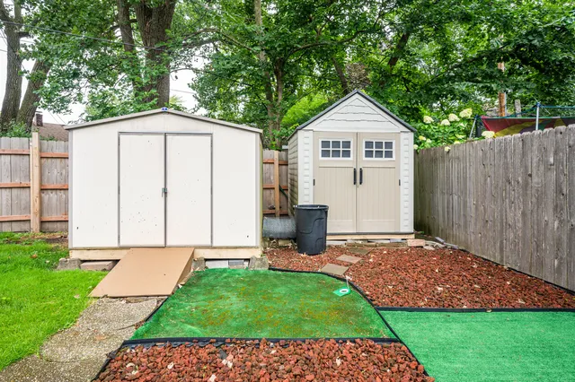 a view of front door of house with yard