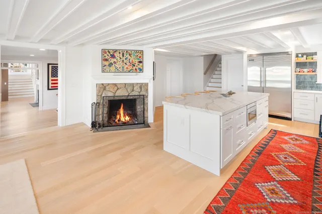 a spacious bedroom with a bed and a fireplace