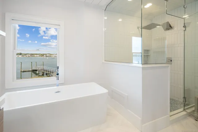 a bathroom with a bathtub and a shower