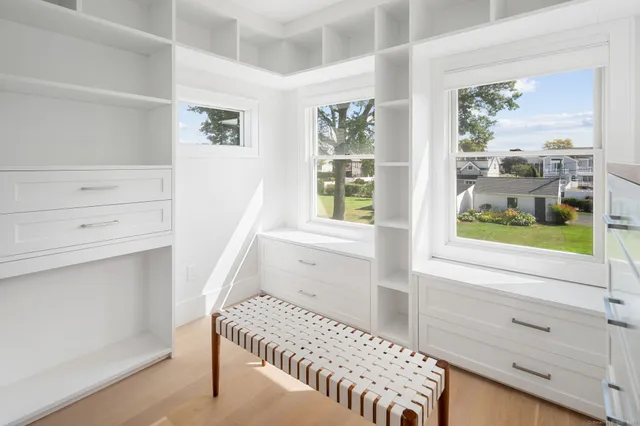 a bedroom with a bed and a window with the outer view
