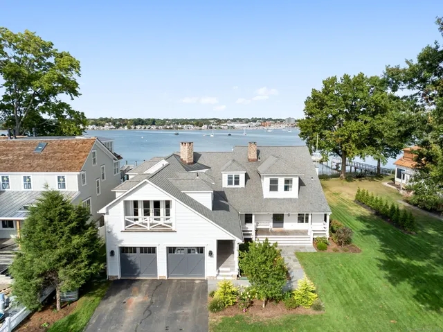 an aerial view of a house with a big yard