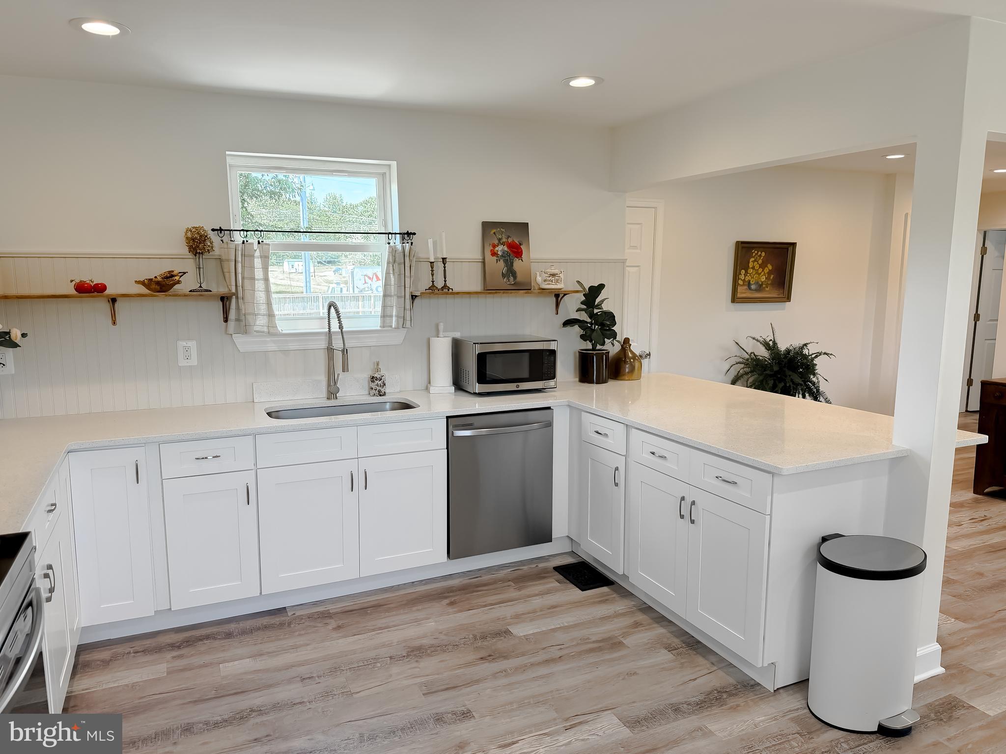 4985 Solomons Island Road Huntingtown, MD 20639 - Photo 11 of 50 a kitchen with sink cabinets and window