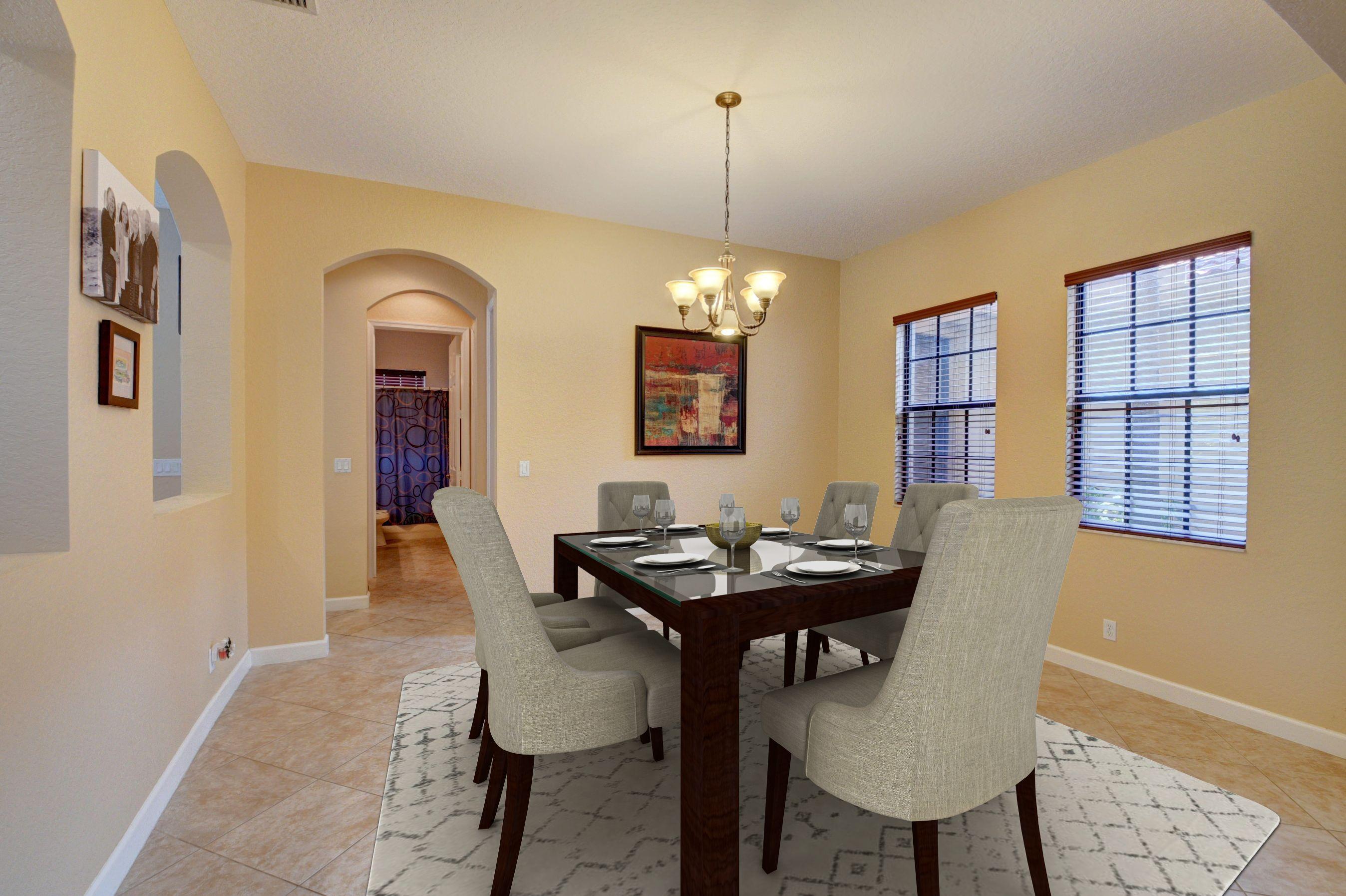 16155 Rosecroft Terrace Delray Beach, FL 33446 - Photo 12 of 40 a dining room with furniture a chandelier and wooden floor
