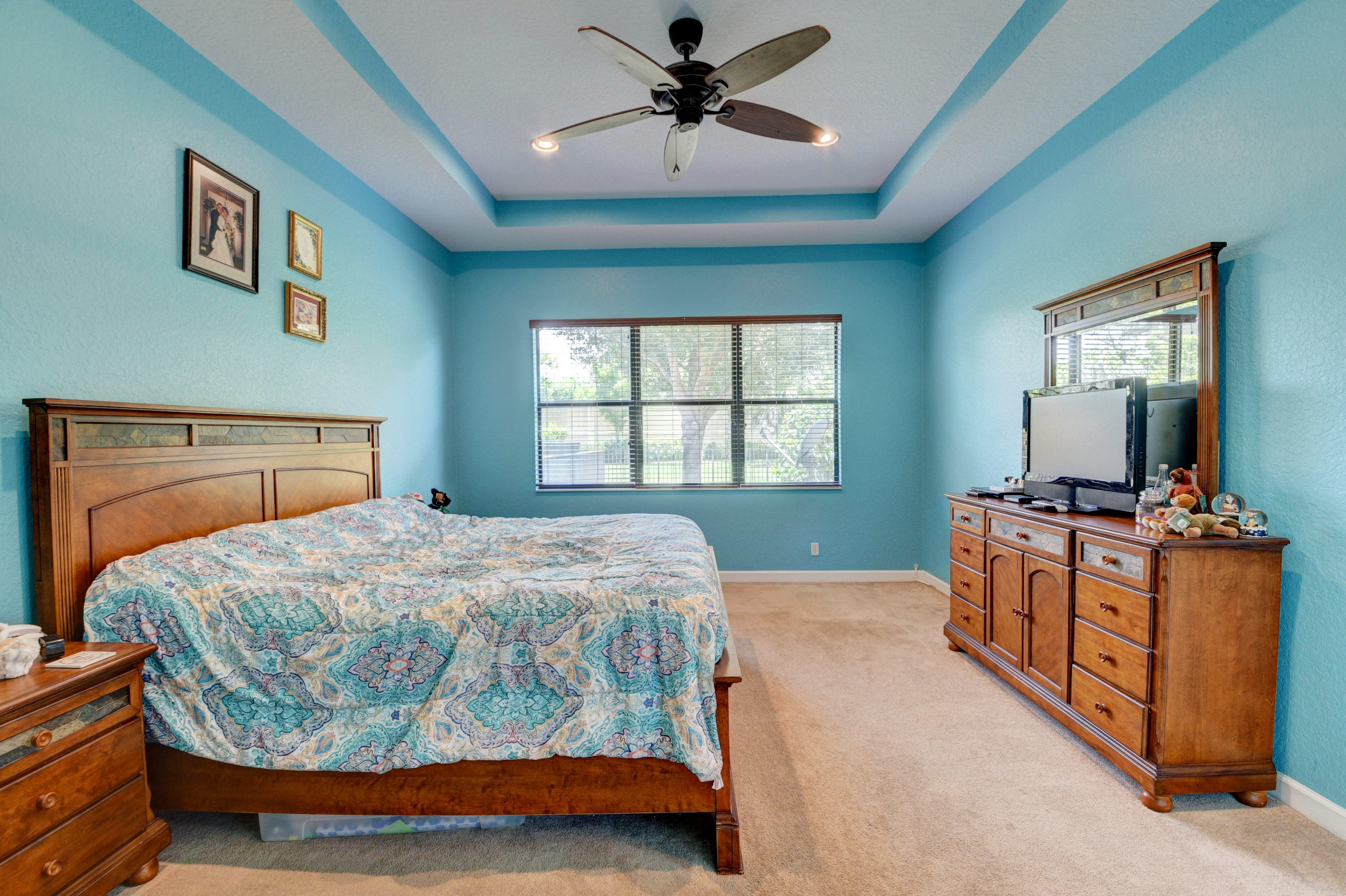 16155 Rosecroft Terrace Delray Beach, FL 33446 - Photo 15 of 40 a bedroom with a bed and a flat screen tv