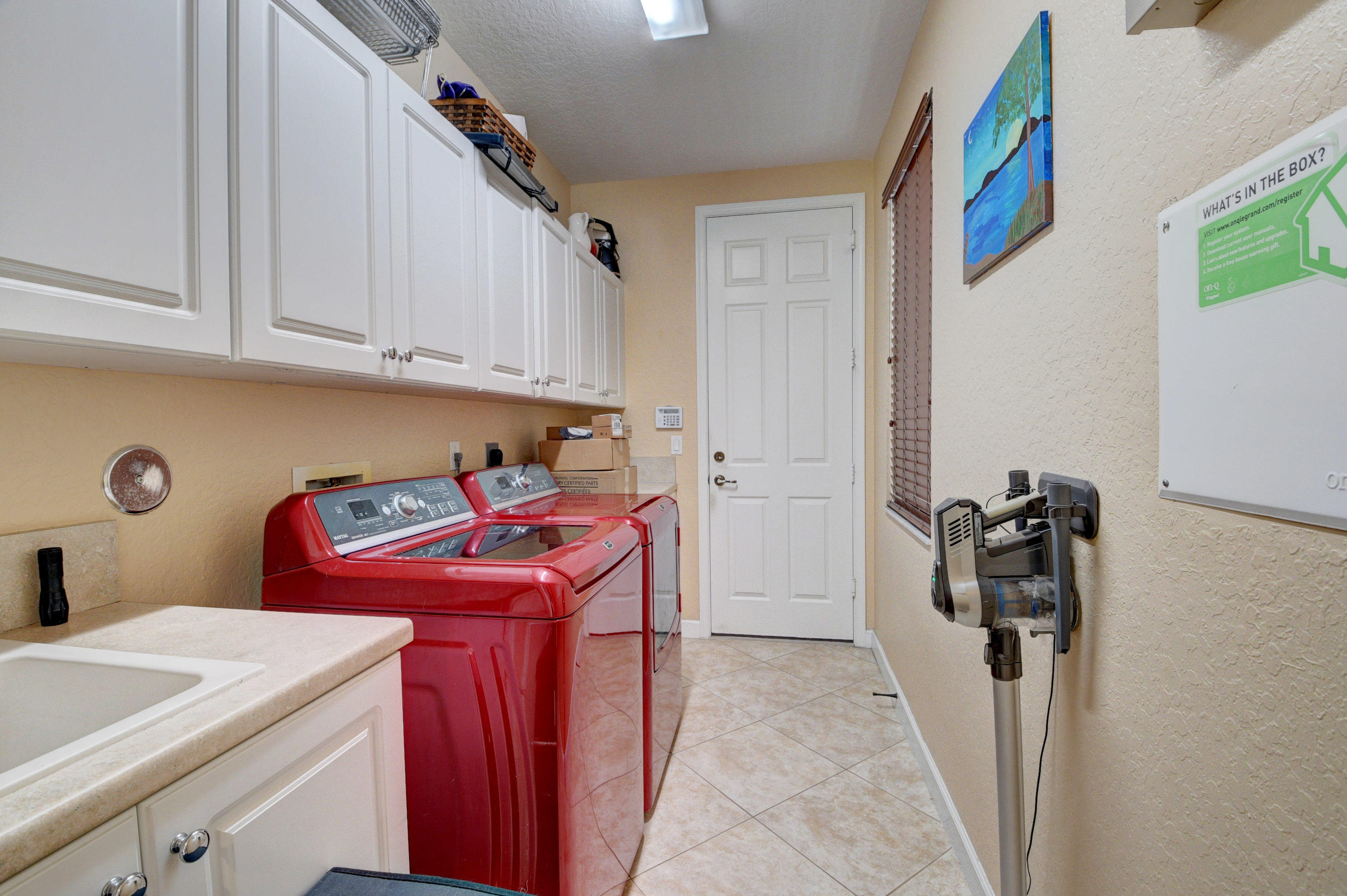16155 Rosecroft Terrace Delray Beach, FL 33446 - Photo 17 of 40 a utility room with dryer and washer