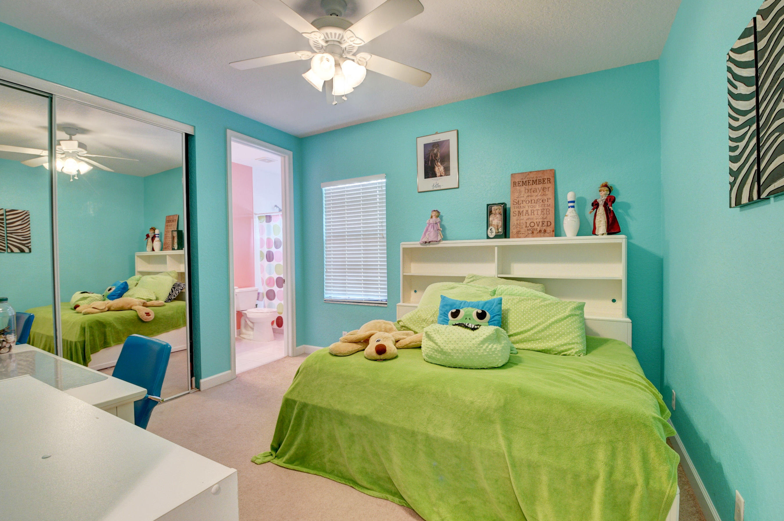 16155 Rosecroft Terrace Delray Beach, FL 33446 - Photo 19 of 40 a bedroom with a bed and ceiling fan