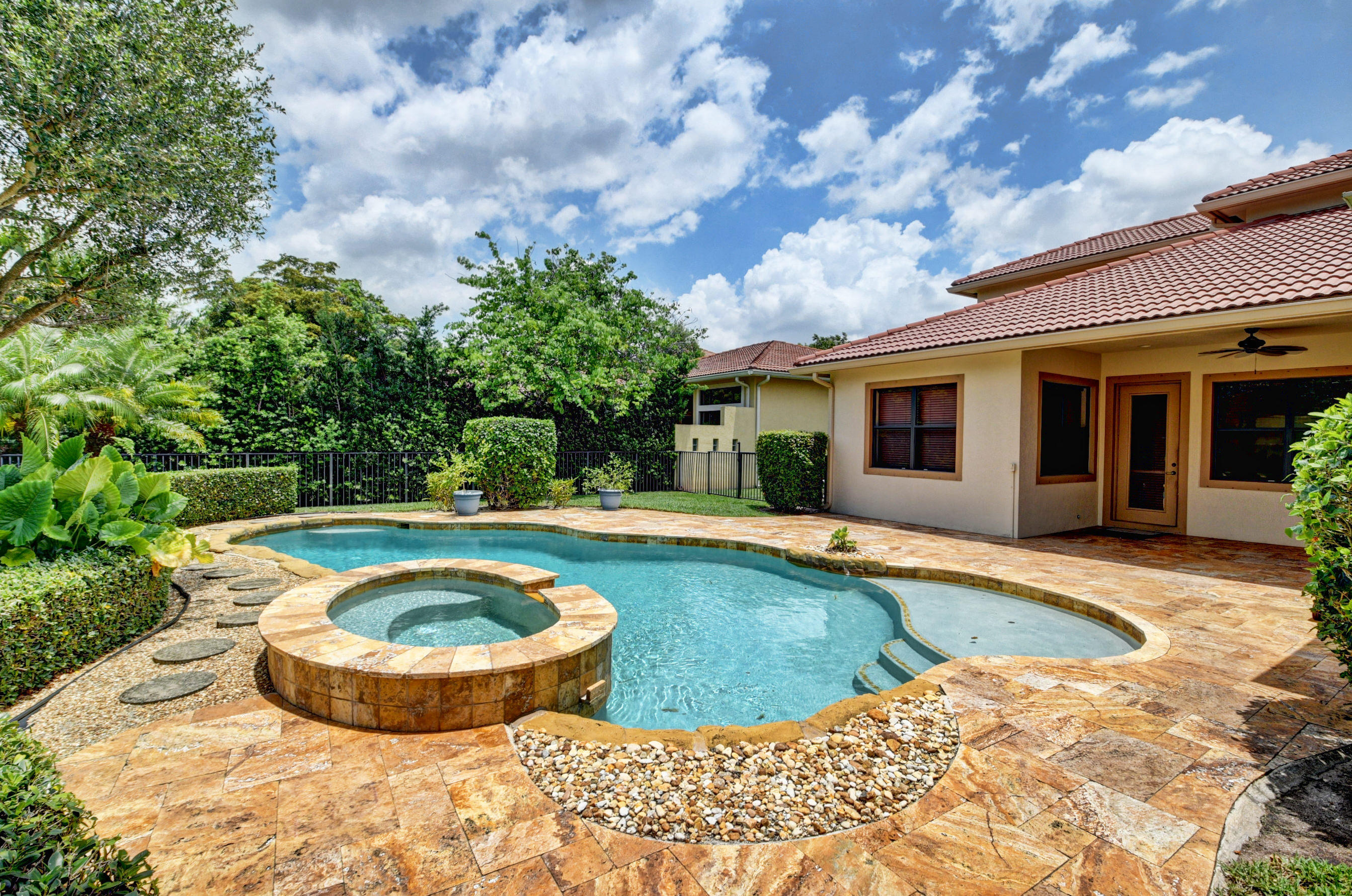 16155 Rosecroft Terrace Delray Beach, FL 33446 - Photo 2 of 40 a view of swimming pool with garden