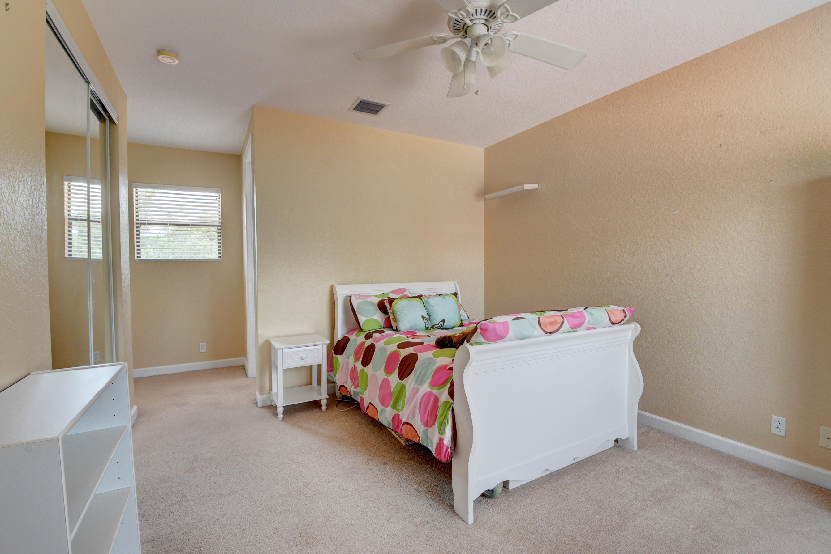 16155 Rosecroft Terrace Delray Beach, FL 33446 - Photo 22 of 40 a bedroom with a bed and window