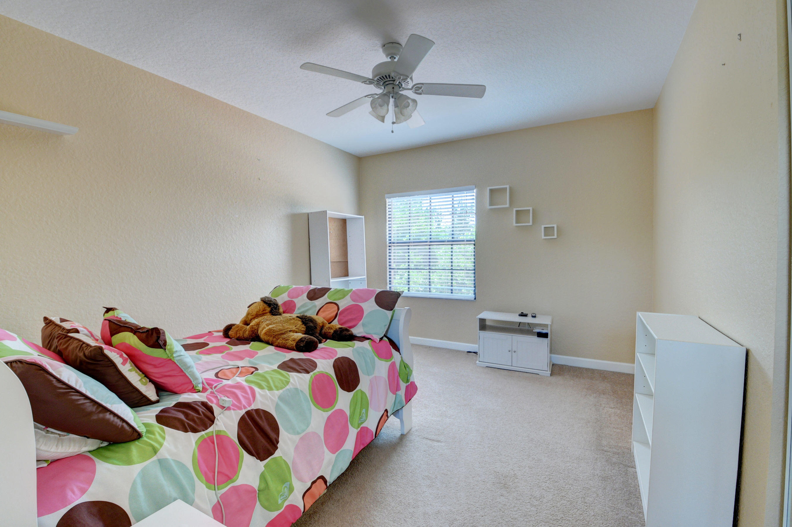 16155 Rosecroft Terrace Delray Beach, FL 33446 - Photo 23 of 40 a bedroom with a bed and window
