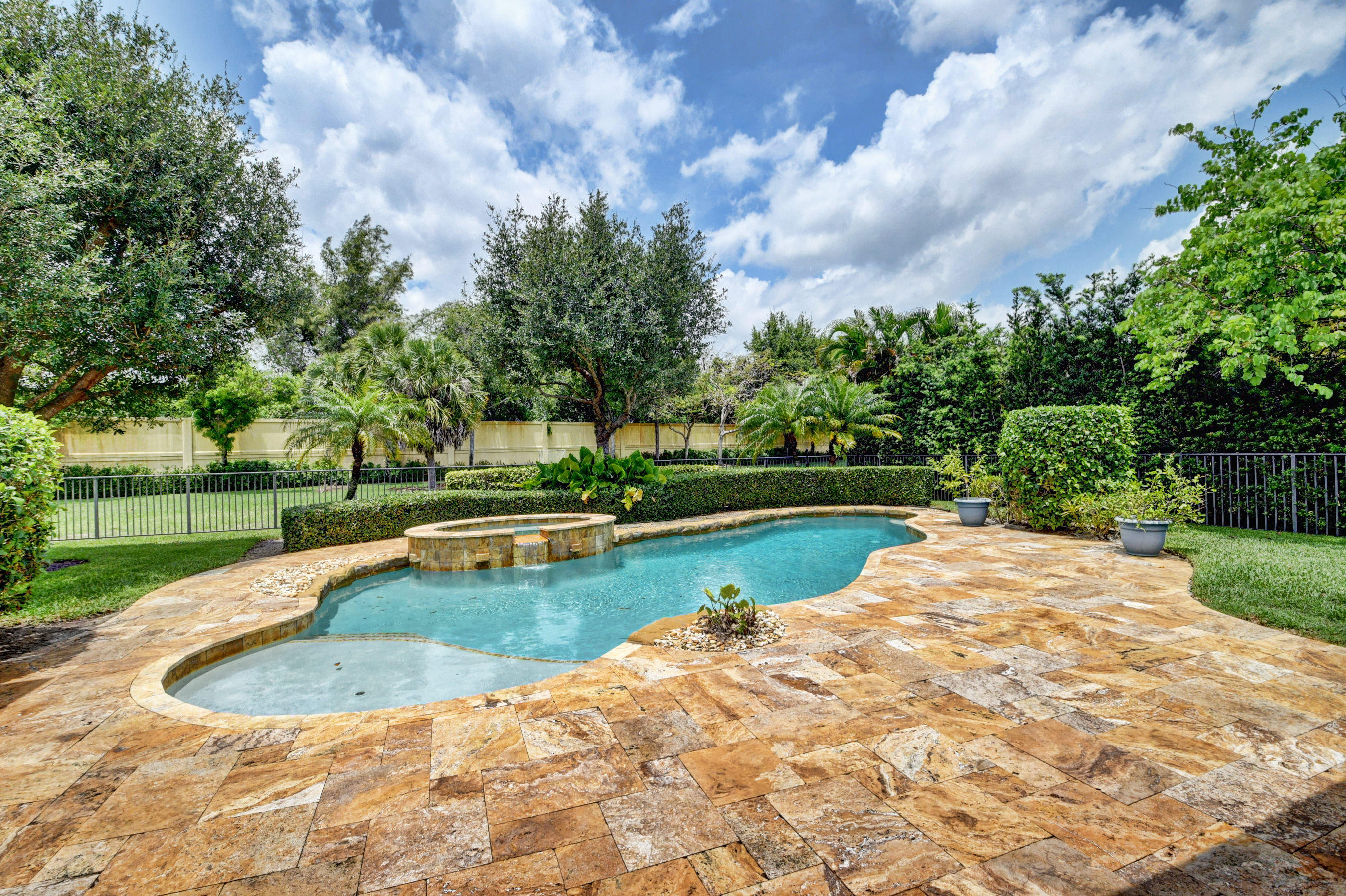 16155 Rosecroft Terrace Delray Beach, FL 33446 - Photo 25 of 40 a view of a swimming pool with a yard