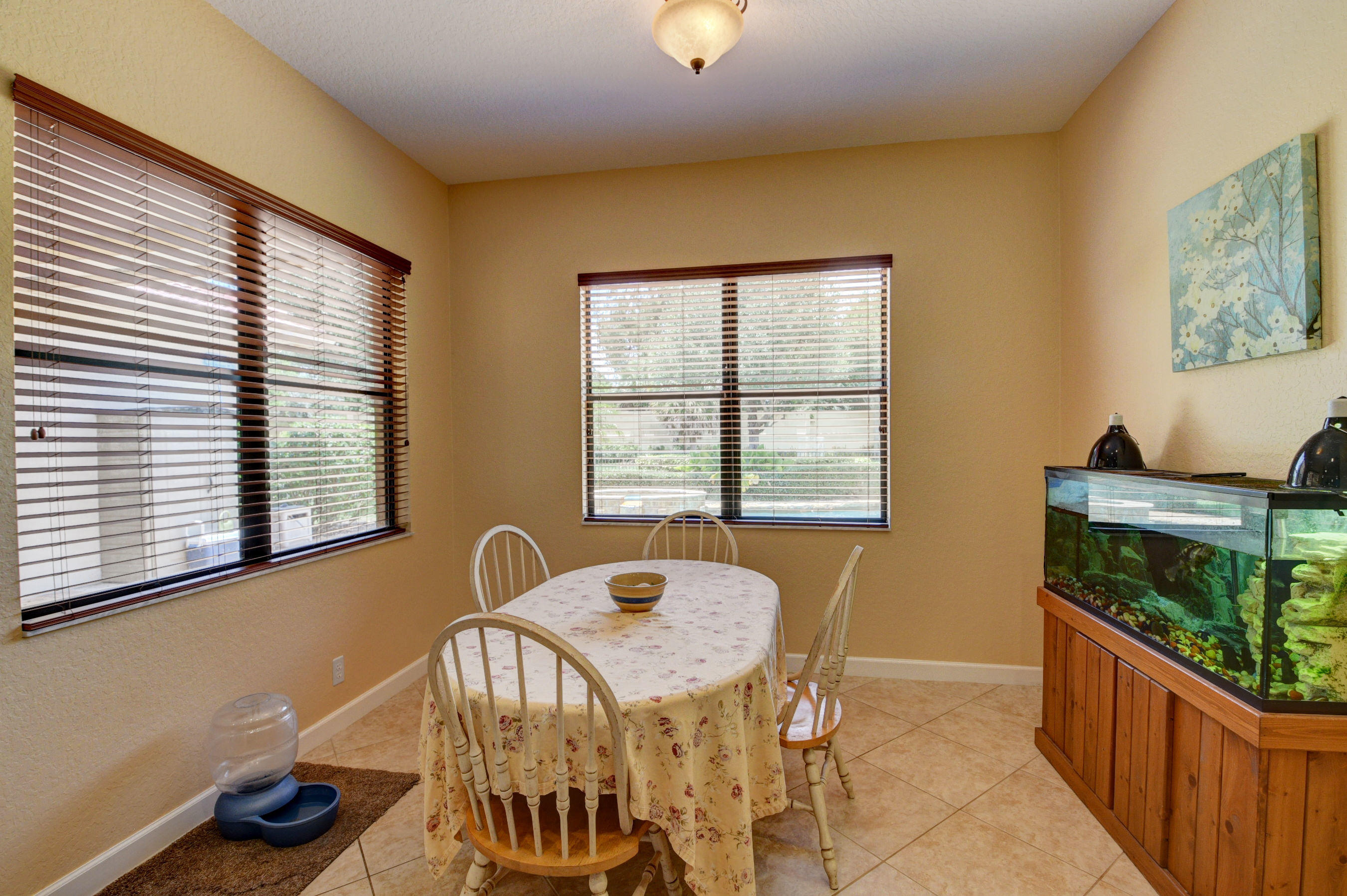 16155 Rosecroft Terrace Delray Beach, FL 33446 - Photo 7 of 40 a view of a dining room with furniture and a window