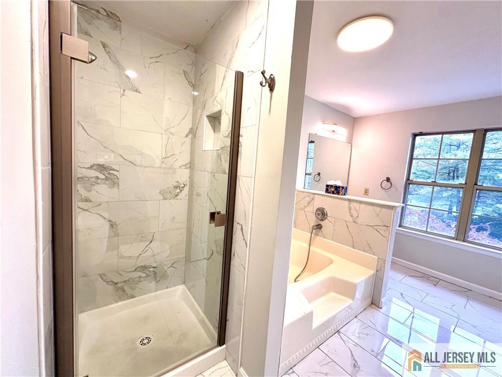 162 Salem Road North Brunswick, NJ 08902 - Photo 14 of 17 a bathroom with a tub shower and a window