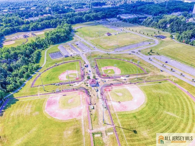a bathroom with a mirror and a bed
