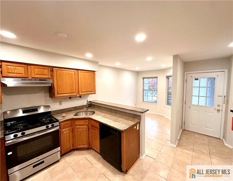162 Salem Road North Brunswick, NJ 08902 - Photo 3 of 17 a kitchen with stainless steel appliances granite countertop a stove a sink and a refrigerator