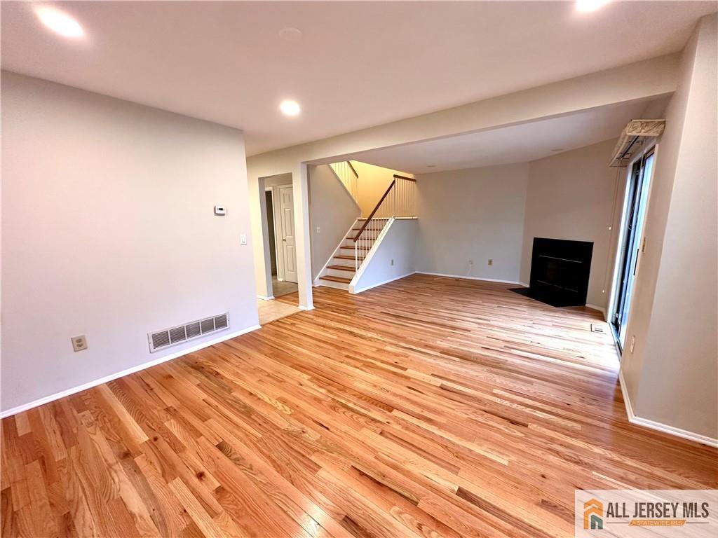 162 Salem Road North Brunswick, NJ 08902 - Photo 5 of 17 a view of empty room with wooden floor