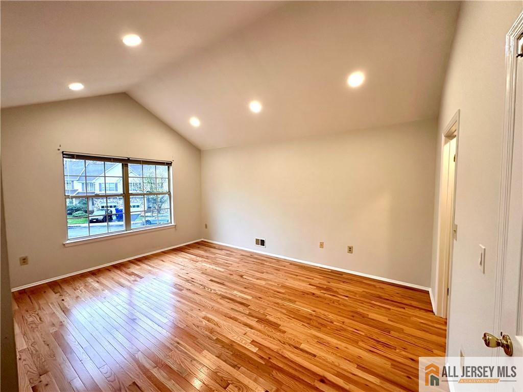 162 Salem Road North Brunswick, NJ 08902 - Photo 10 of 17 a view of an empty room with wooden floor and a window