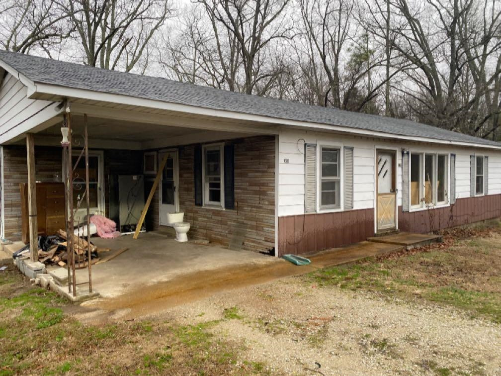 680 Austin Road Reagan, TN 38368 - Photo 2 of 12 a view of a house with backyard porch and sitting area