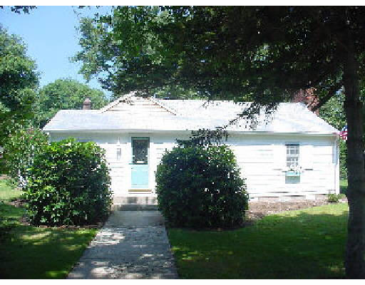 a view of a house with a yard and a garden