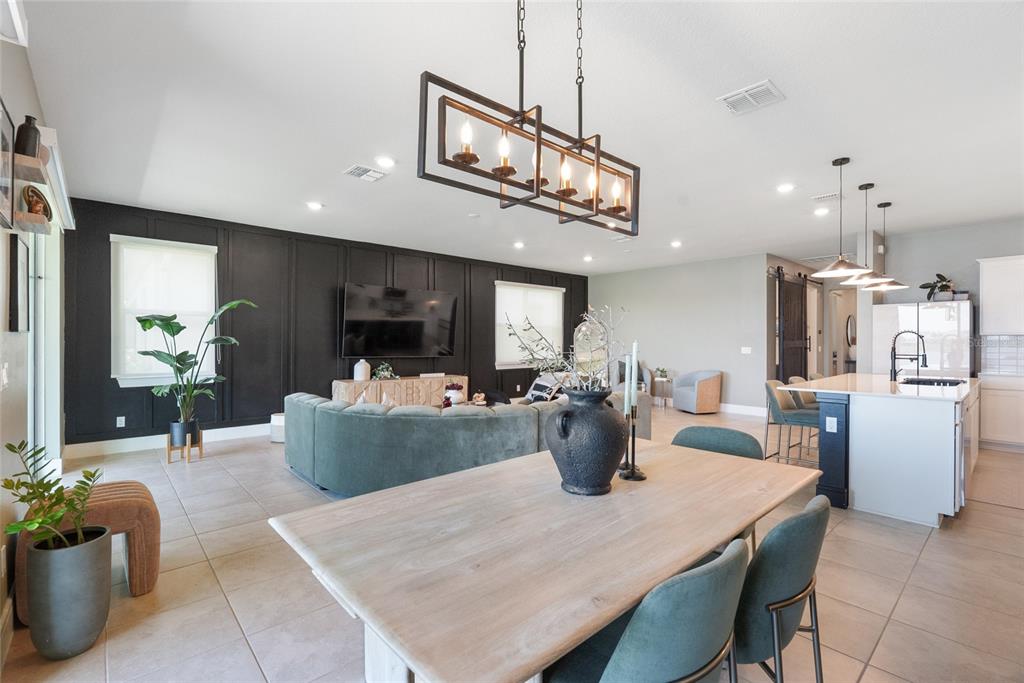 1634 Groveline Road St. Cloud, FL 34771 - Photo 9 of 43 a view of a dining room with furniture and a chandelier