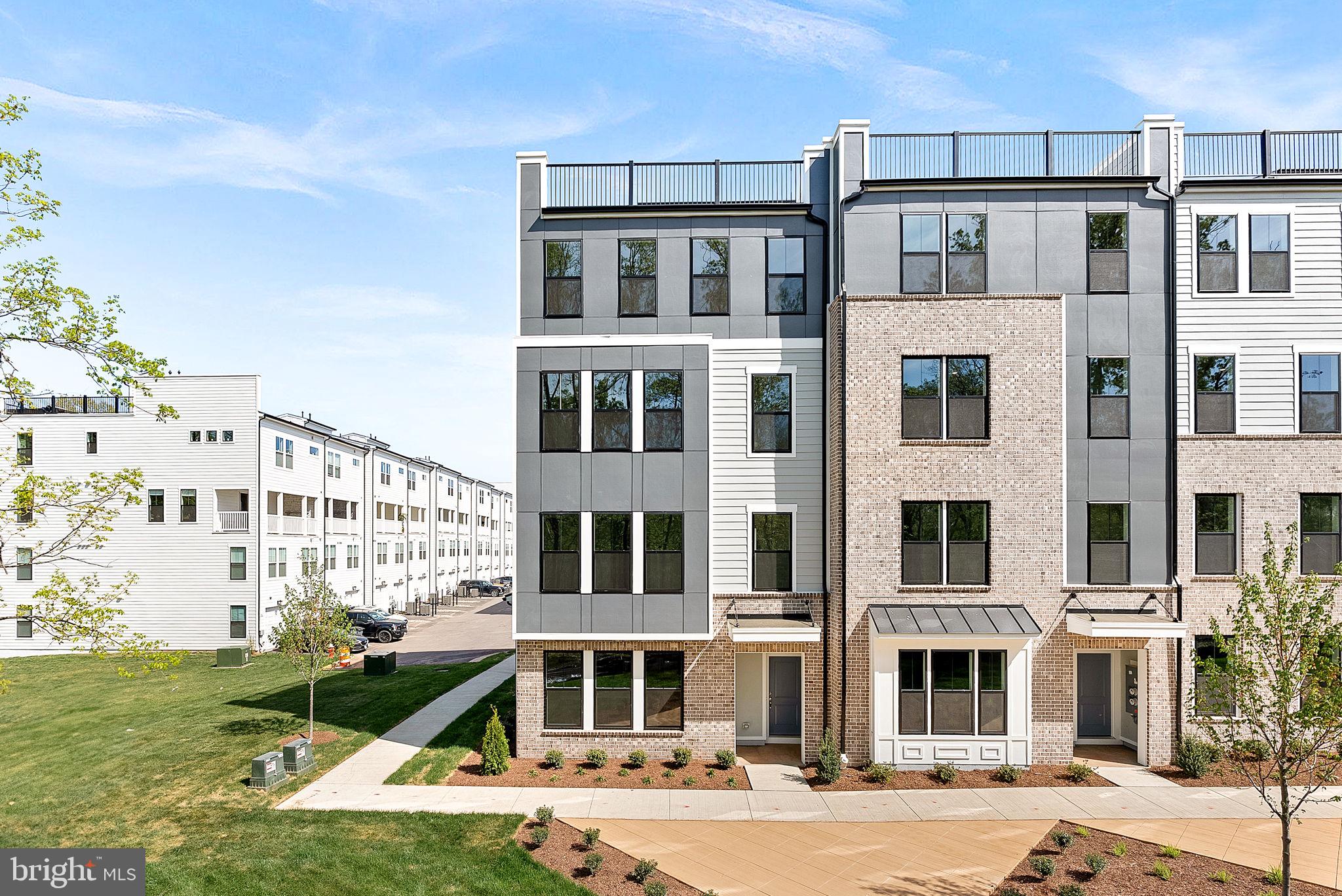 a front view of a building with a yard