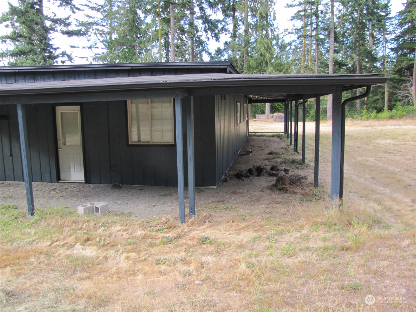 726 Lake Farm Road Port Angeles, WA 98362 - Photo 3 of 24 a backyard of a house