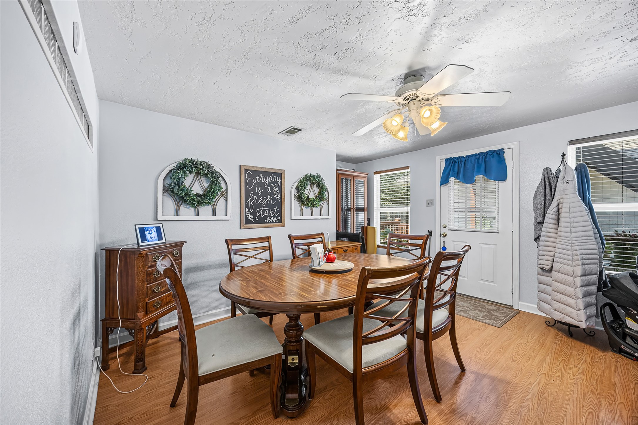 2519 Wood River Road Spring, TX 77373 - Photo 9 of 26 a view of a dining room with furniture and wooden floor