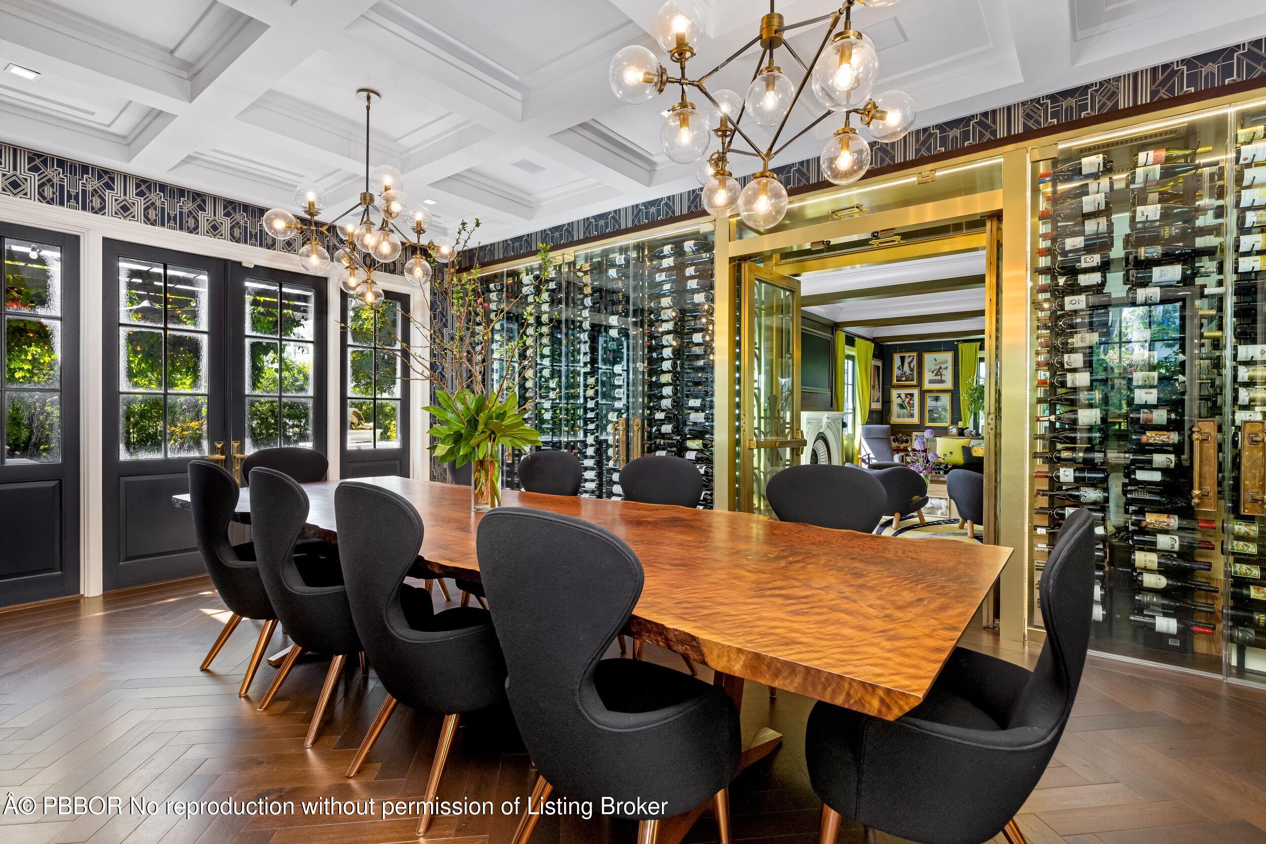 1053 North Lake Way Palm Beach, FL 33480 - Photo 22 of 82 a view of a dining room with furniture wooden floor and chandelier